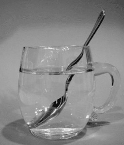 refraction of a wave-a spoon in a glass of water
